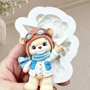 Ursinho aviador com avião de papel
